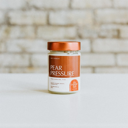 pear pressure candle. funny soy candle made by the copper bell. pear, riesling, and pine scented candle.