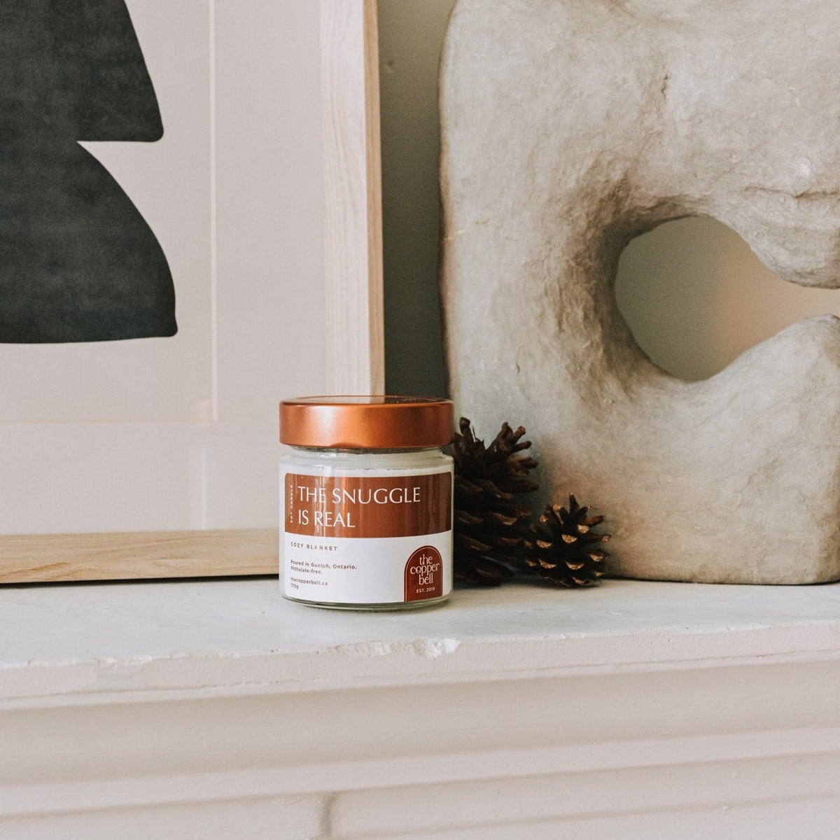 the snuggle is real. scented soy candle made by the copper bell. cozy fall candle