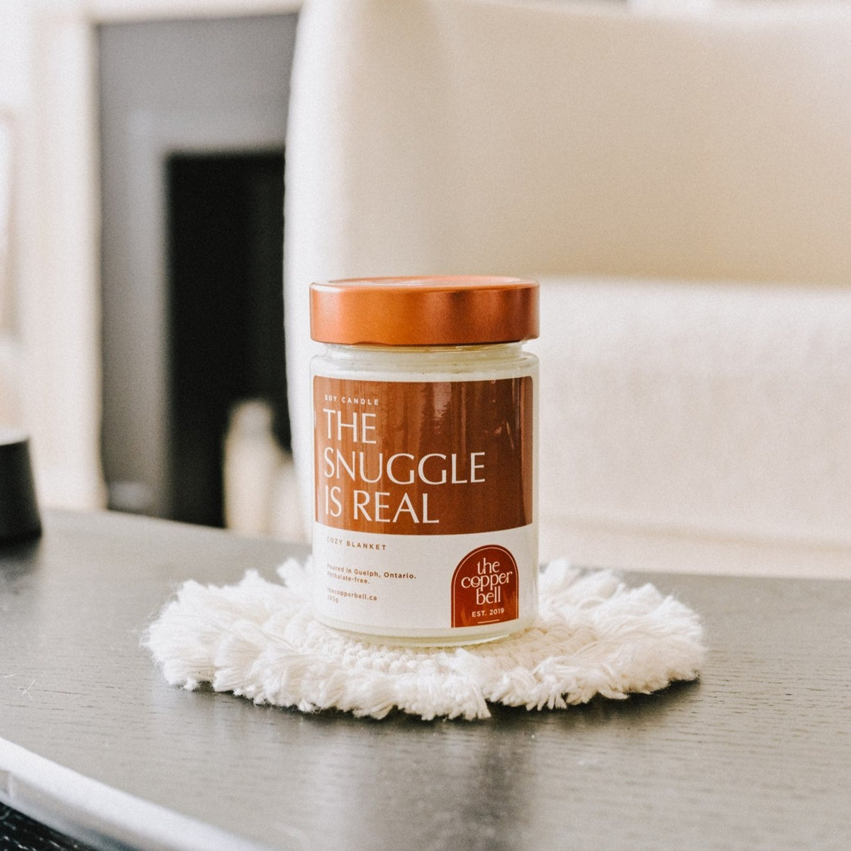 the snuggle is real. scented soy candle made by the copper bell. sweet and cozy blanket candle