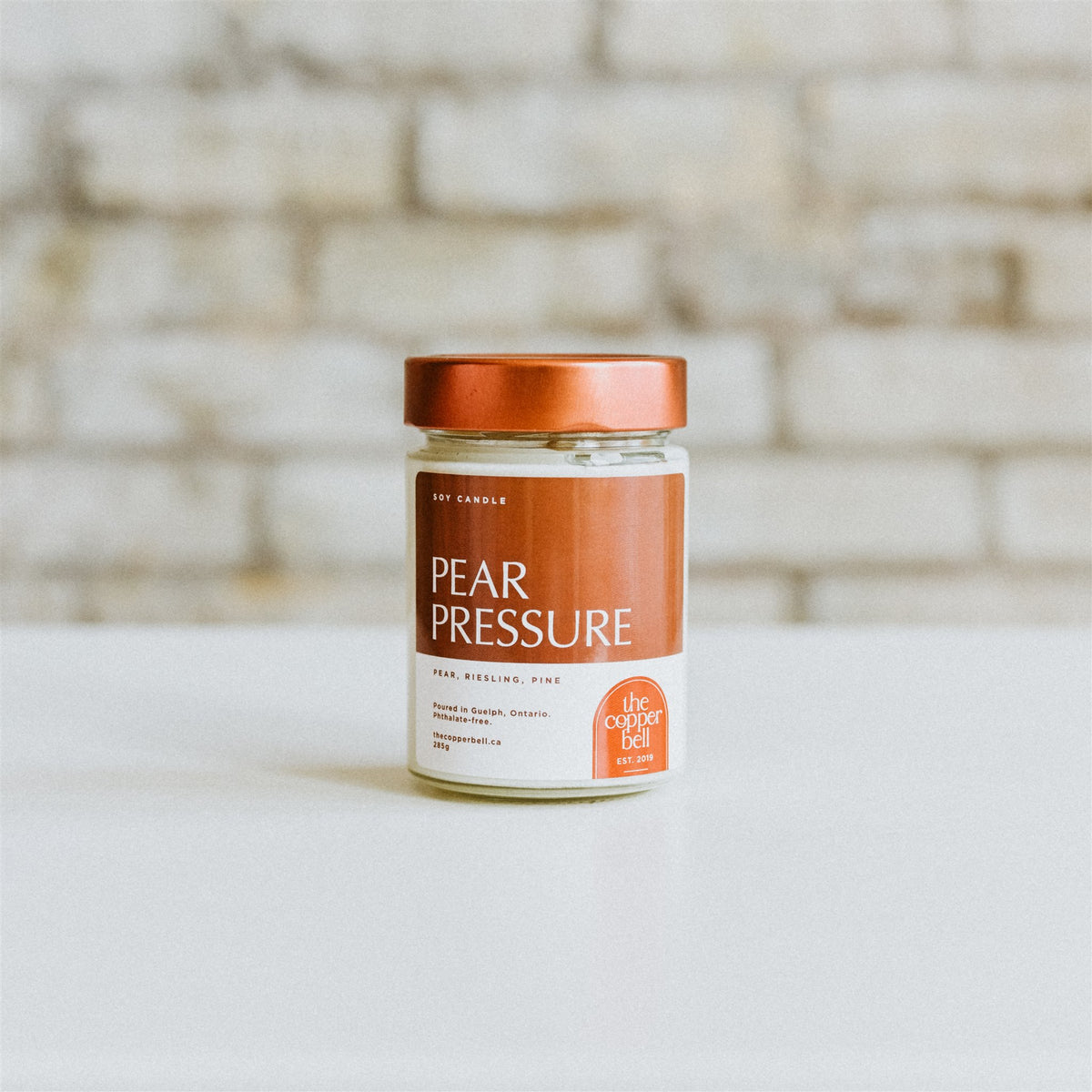 pear pressure candle. funny soy candle made by the copper bell. pear, riesling, and pine scented candle.
