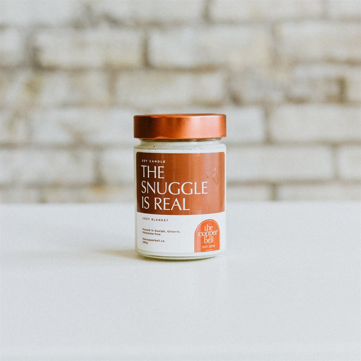 cozy fall candle named the snuggle is real. cozy blanket scent