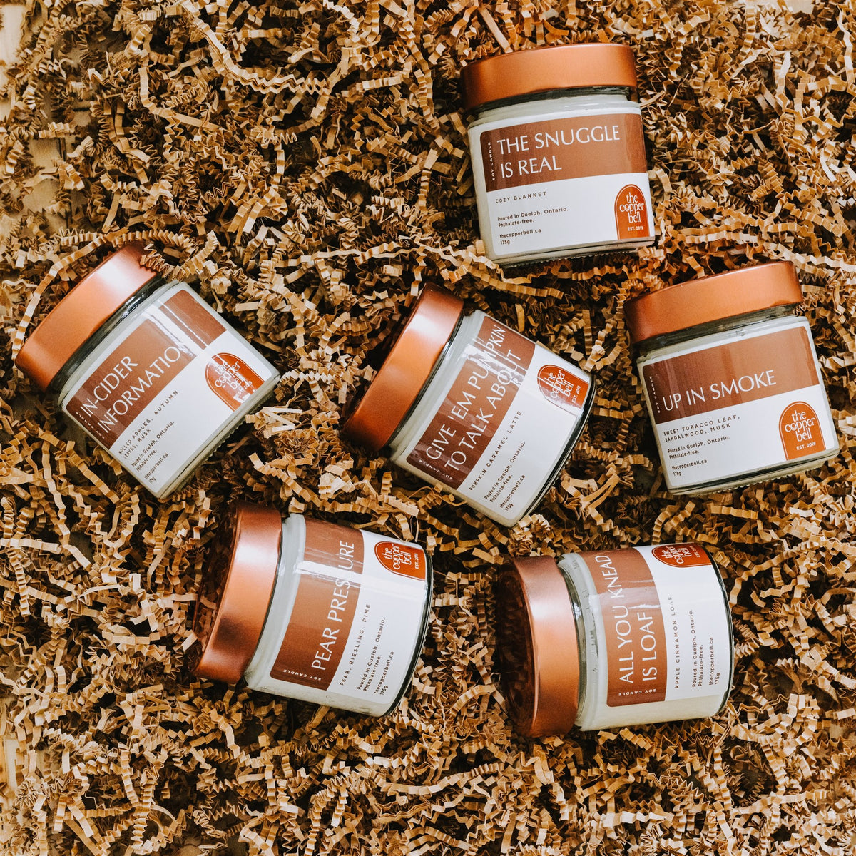 6 fall candles on a bed of kraft paper. a perfect gift for your funny best friend.
