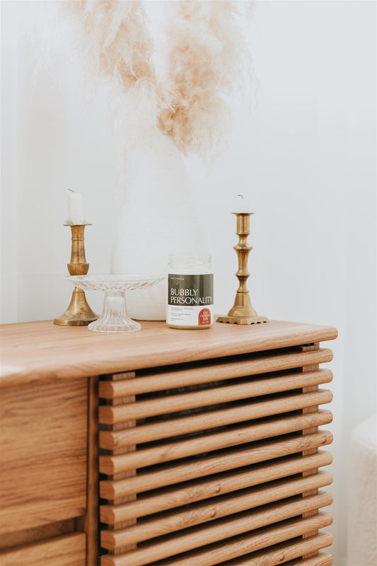 funny soy candle made by the copper bell. grapefruit, orange, and champagne scented candle