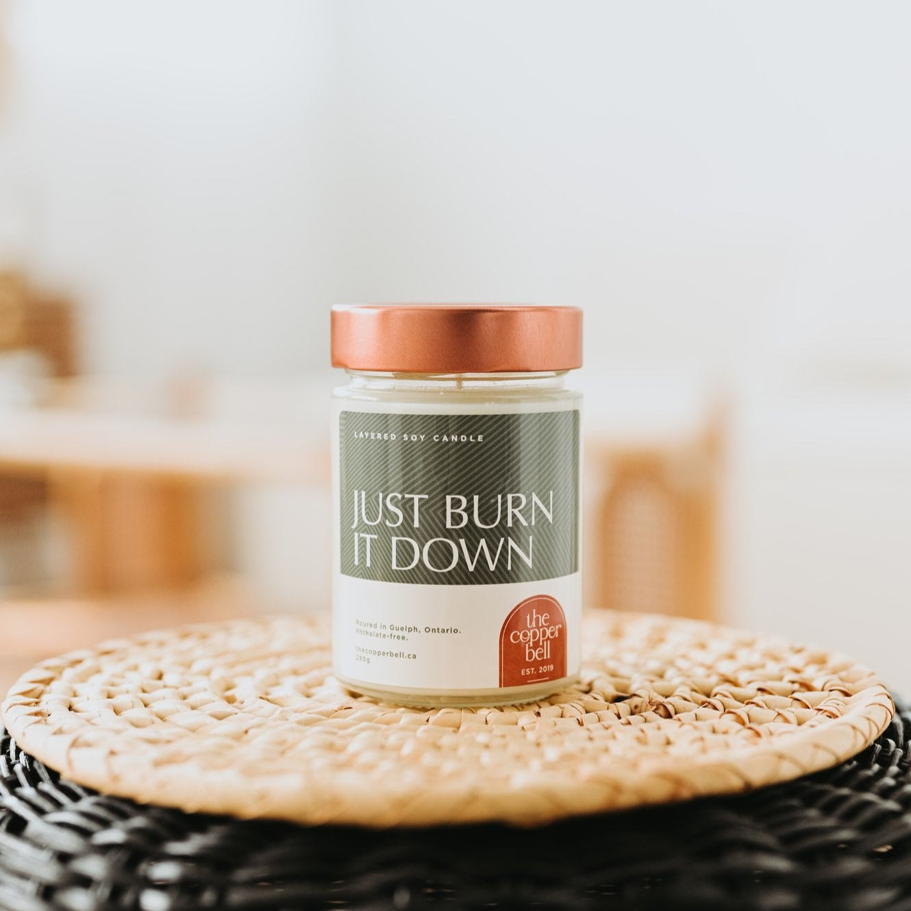 just burn it down funny soy candle. for the times you just want to burn the world down, light a candle instead. layered soy candle displayed on a wicker basket